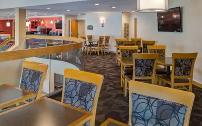 a dining room with tables and chairs in a restaurant at LivINN Hotel Cincinnati North/ Sharonville in Sharonville