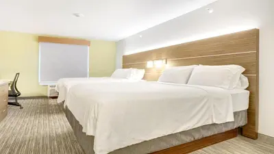 a hotel room with two beds and a window at Holiday Inn Express Hotel & Suites Portland by IHG in Portland