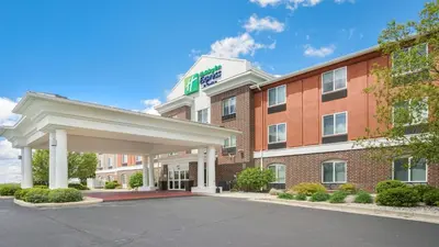 a hotel with a sign on the front of a building at Holiday Inn Express Hotel & Suites Portland by IHG in Portland