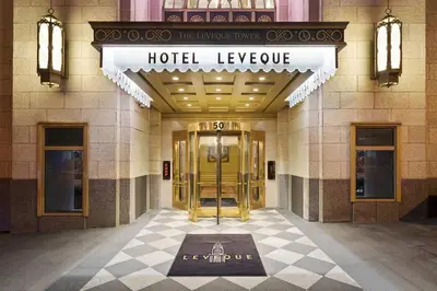 a hotel lobby with a hotel welcome sign on the door at Hotel LeVeque, Autograph Collection in Columbus