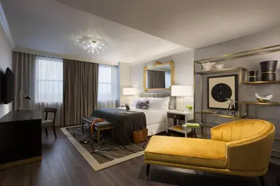 a hotel room with a bed and a desk at Hotel LeVeque, Autograph Collection in Columbus