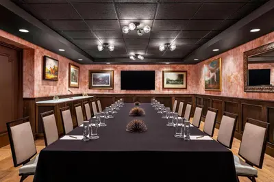a conference room with a long table and chairs at Hotel LeVeque, Autograph Collection in Columbus