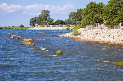 a river with some rocks in the water at Cedar Point's Lighthouse Point in Sandusky