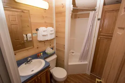 a small bathroom with a sink and a toilet at Cedar Point's Lighthouse Point in Sandusky