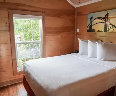 a bedroom with a large bed and a window at Cedar Point's Lighthouse Point in Sandusky