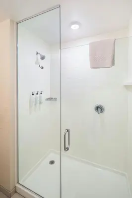 a shower with a glass door in a bathroom at Fairfield Inn & Suites by Marriott Akron Stow in Stow