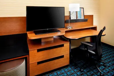 a desk with a television on top of it at Fairfield by Marriott Inn & Suites Wheeling at The Highlands in Triadelphia