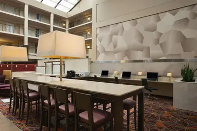 a conference room with a table and chairs at Embassy Suites Cleveland - Beachwood in Beachwood