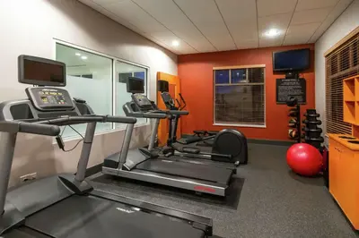 a gym with two tread machines and a treadmill at Hilton Garden Inn Columbus/Dublin in Dublin