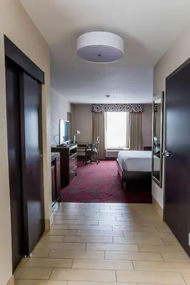 a hotel room with a bed and a desk at Hilton Garden Inn Columbus/Dublin in Dublin