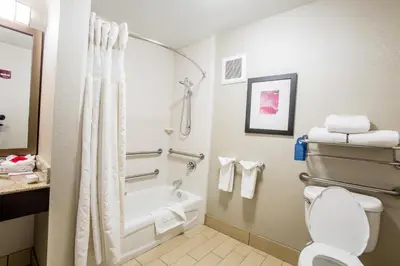 a bathroom with a bath tub and a toilet at Hilton Garden Inn Columbus/Dublin in Dublin