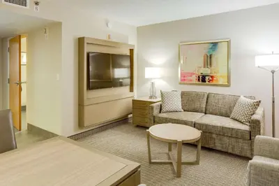 a living room with a couch and a table at Embassy Suites by Hilton Columbus Dublin in Dublin