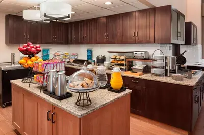 a kitchen with a counter with food on it at Homewood Suites by Hilton Columbus-Hilliard in Hilliard