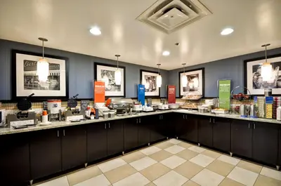 a room with a counter with a lot of food at Hampton Inn Columbus/Dublin in Dublin