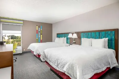 a hotel room with two beds and a window at Hampton Inn Columbus/Dublin in Dublin