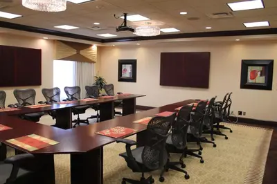 a conference room with tables and chairs in it at Hilton Garden Inn Cincinnati Blue Ash in Blue Ash