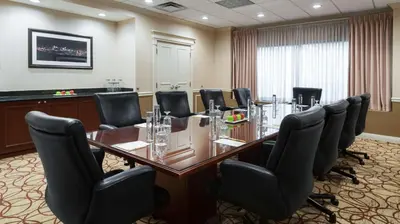 a conference room with a long table and chairs at DoubleTree Suites by Hilton Hotel Cincinnati - Blue Ash in Sharonville