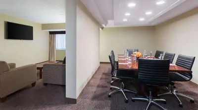 a conference room with a table and chairs at DoubleTree Suites by Hilton Hotel Cincinnati - Blue Ash in Sharonville