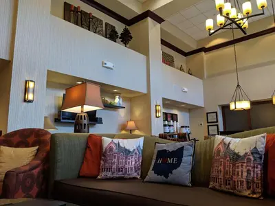 a living room with a couch with pillows on it at Hampton Inn & Suites Cincinnati-Union Centre in West Chester