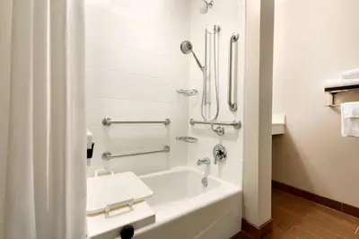 a bathroom with a bath tub and a sink at TownePlace Suites by Marriott Pittsburgh Airport/Robinson Township in Robinson Township