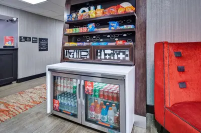 a drink cooler in a store with drinks in it at Hampton Inn Columbus/Delaware I-71 North in Sunbury