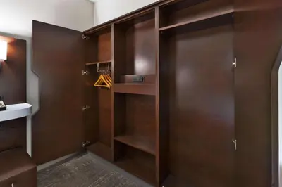 a walk in closet with wooden doors at Hampton Inn Columbus/Delaware I-71 North in Sunbury