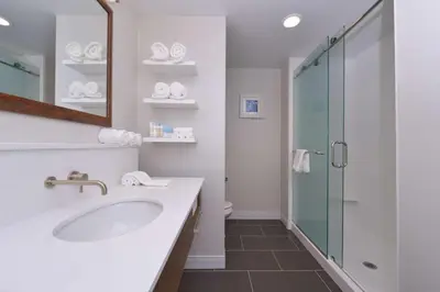 a bathroom with a sink and a glass shower at Hampton Inn & Suites Cincinnati-Mason, Ohio in Mason