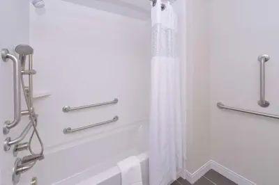 a shower with a white shower curtain in a bathroom at Hampton Inn & Suites Cincinnati-Mason, Ohio in Mason