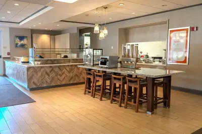 a kitchen with a large island in the middle at Hilton Garden Inn Pittsburgh/Southpointe in Canonsburg