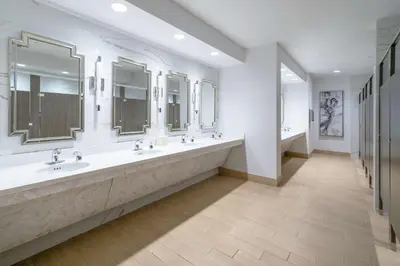 a large bathroom with two sinks and mirrors at Hilton Garden Inn Pittsburgh/Southpointe in Canonsburg