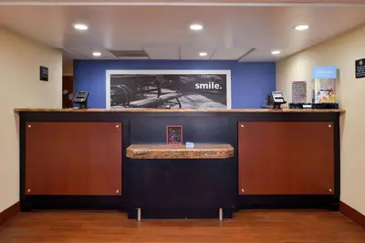 a bar with a smile sign on the wall at Hampton Inn Columbus-East in Pickerington