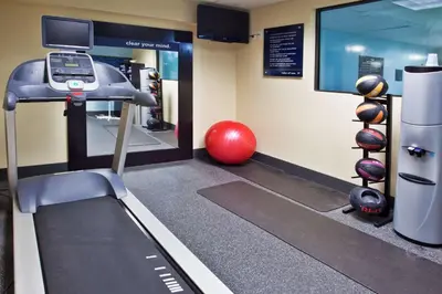 a gym with a treadmill and a gym ball at Hampton Inn Columbus-East in Pickerington