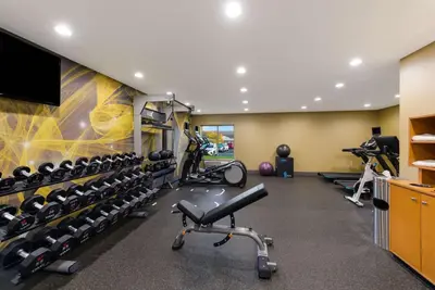 a gym with treadmills and bikes in a room at Hilton Garden Inn Columbus/Grove City in Grove City