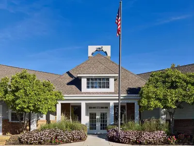 a house with an american flag on top of it at Sonesta ES Suites Cincinnati - Sharonville East in Sharonville