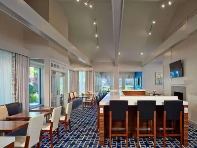 a large dining room with a large table and chairs at Sonesta ES Suites Cincinnati - Sharonville East in Sharonville