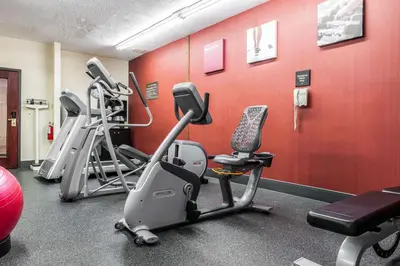 a gym with several exercise bikes in a room at Comfort Inn Blue Ash North in Blue Ash