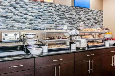 a buffet line with many different types of food at Comfort Inn Blue Ash North in Blue Ash