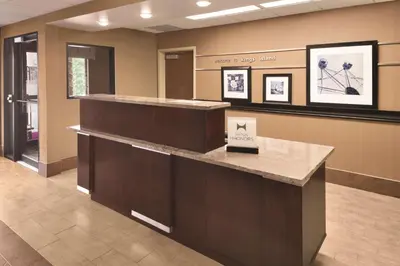 a lobby of a hospital with a reception counter at Hampton Inn Cincinnati Kings Island in Mason
