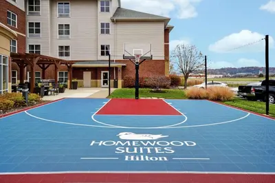 a basketball court in front of a house at Homewood Suites by Hilton Cincinnati-Milford in Milford