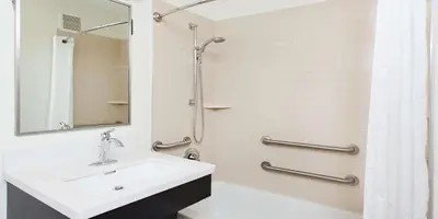 a bathroom with a sink and a shower at Sonesta Simply Suites Pittsburgh Airport in Imperial