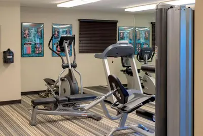 a gym with two exercise bikes in a room at Sonesta Simply Suites Pittsburgh Airport in Imperial