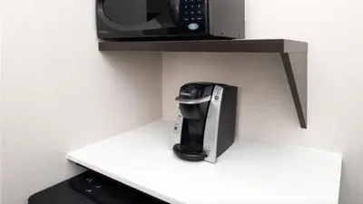 a coffee maker and a microwave on a shelf at Holiday Inn Express Cincinnati West by IHG in Dent