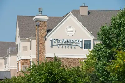 a building with a sign that reads stay bridge suites at Staybridge Suites Columbus-Airport by IHG in Columbus