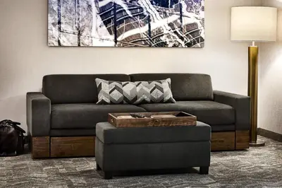 a living room with a couch and a table at SpringHill Suites by Marriott Cleveland Independence in Independence