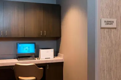a room with a desk with a computer and a chair at SpringHill Suites by Marriott Cleveland Independence in Independence