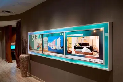 a wall with four large windows in a room at SpringHill Suites by Marriott Dayton Beavercreek in New Germany