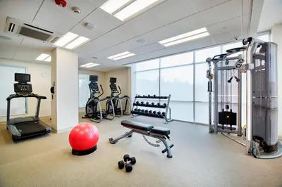 a gym with a fitness room with exercise equipment at SpringHill Suites by Marriott Dayton Beavercreek in New Germany