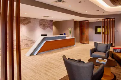 a lobby with a reception desk and chairs at SpringHill Suites by Marriott Dayton Beavercreek in New Germany