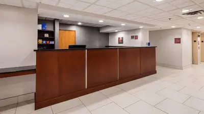 a lobby of a hospital with a reception desk at The Hotel at Dayton South in Dayton