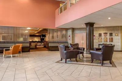 a lobby with chairs and a waiting room at Quality Hotel Conference Center Cincinnati Blue Ash in Blue Ash